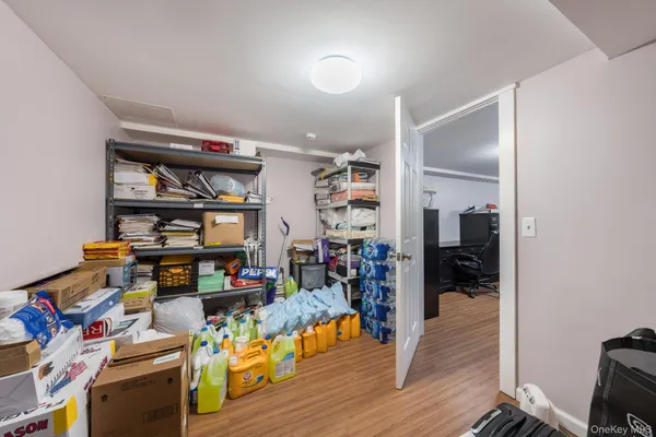 a living room with lots of furniture and wooden floor