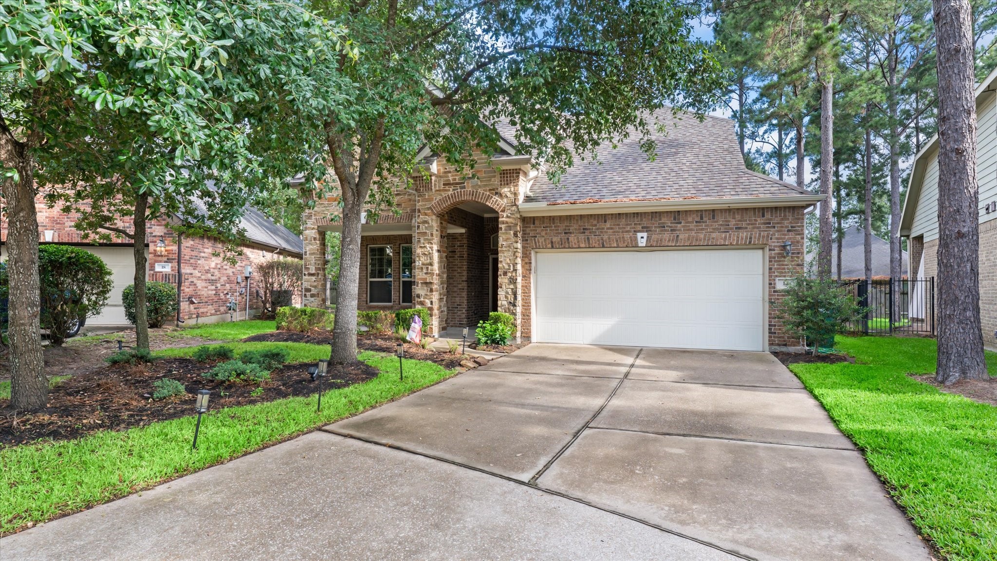 14 Painted Post Place Spring, TX 77389 - Photo 1 of 43 a front view of a house with a garden