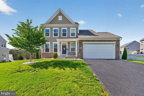 front view of a house with a yard