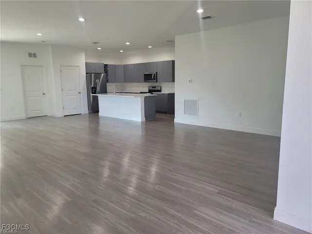 a view of kitchen with wooden floor