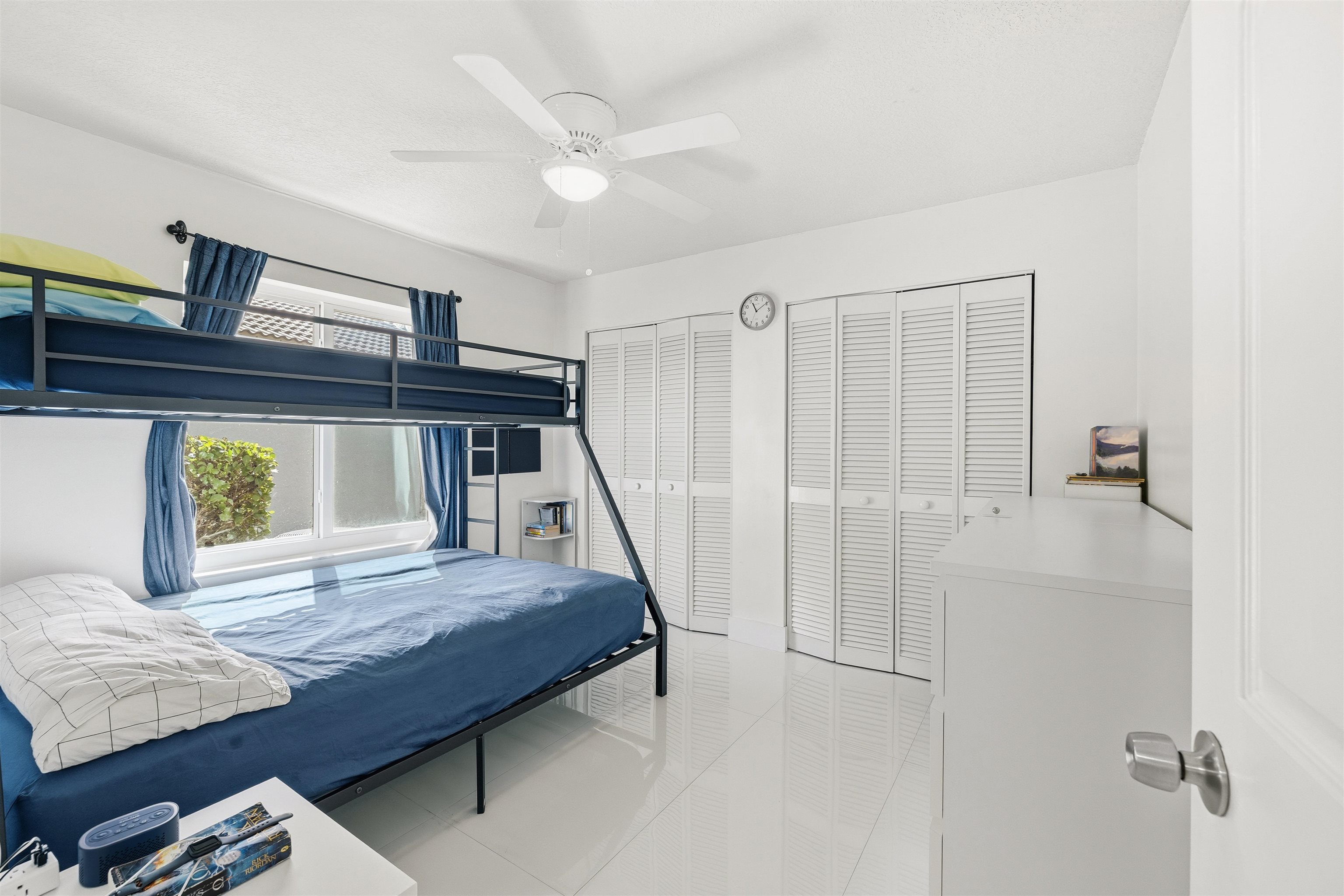 75 Gables Boulevard Weston, FL 33326 - Photo 17 of 29 Bedroom featuring multiple closets, light tile patterned floors, and a ceiling fan