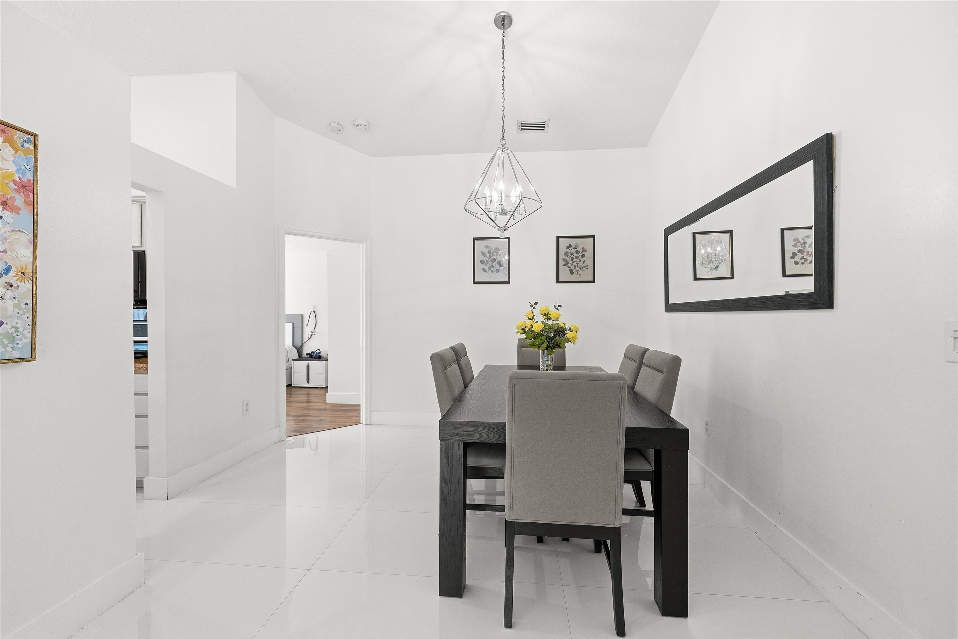 75 Gables Boulevard Weston, FL 33326 - Photo 7 of 29 Dining area with light tile patterned floors and a chandelier