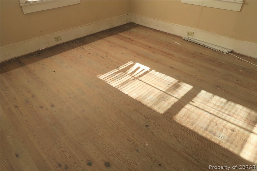 44 Senora Road Lancaster, VA 22503 - Photo 7 of 26 Great pine floors through much of the home. Most likely covered by rugs or carpet previously so in nice shape.