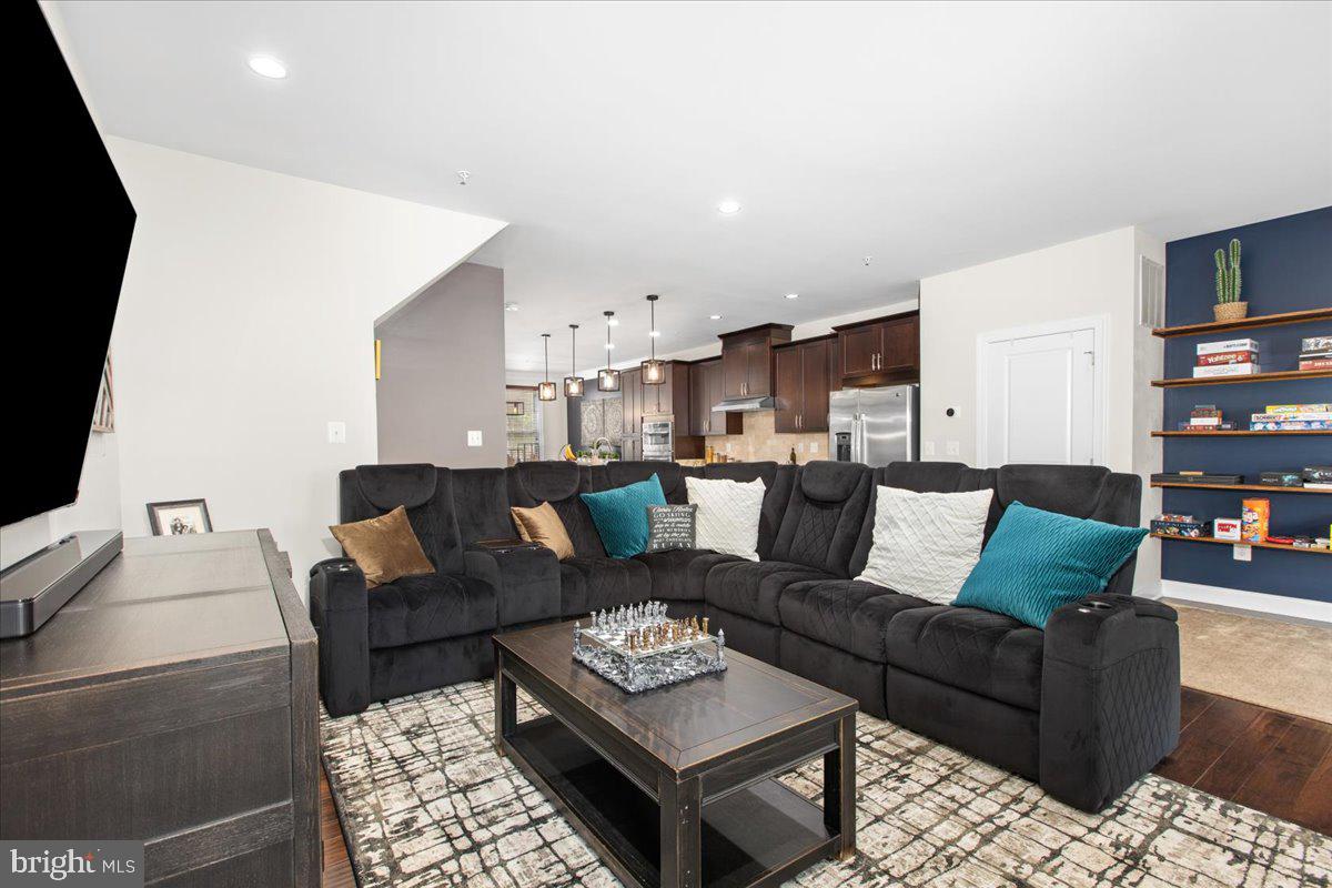 2617 Maple Rock Road Hanover, MD 21076 - Photo 22 of 53 a living room with furniture and a flat screen tv