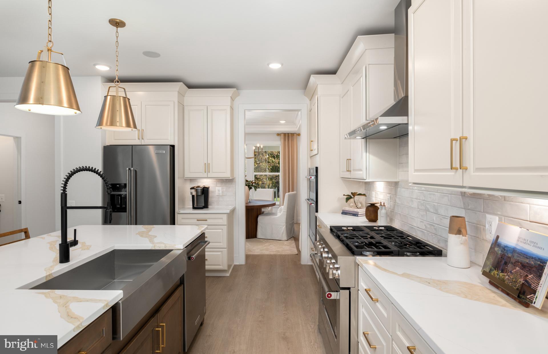 18279 Cresswell Rst Lane Leesburg, VA 20176 - Photo 22 of 60 a kitchen with stainless steel appliances granite countertop a sink stove and refrigerator