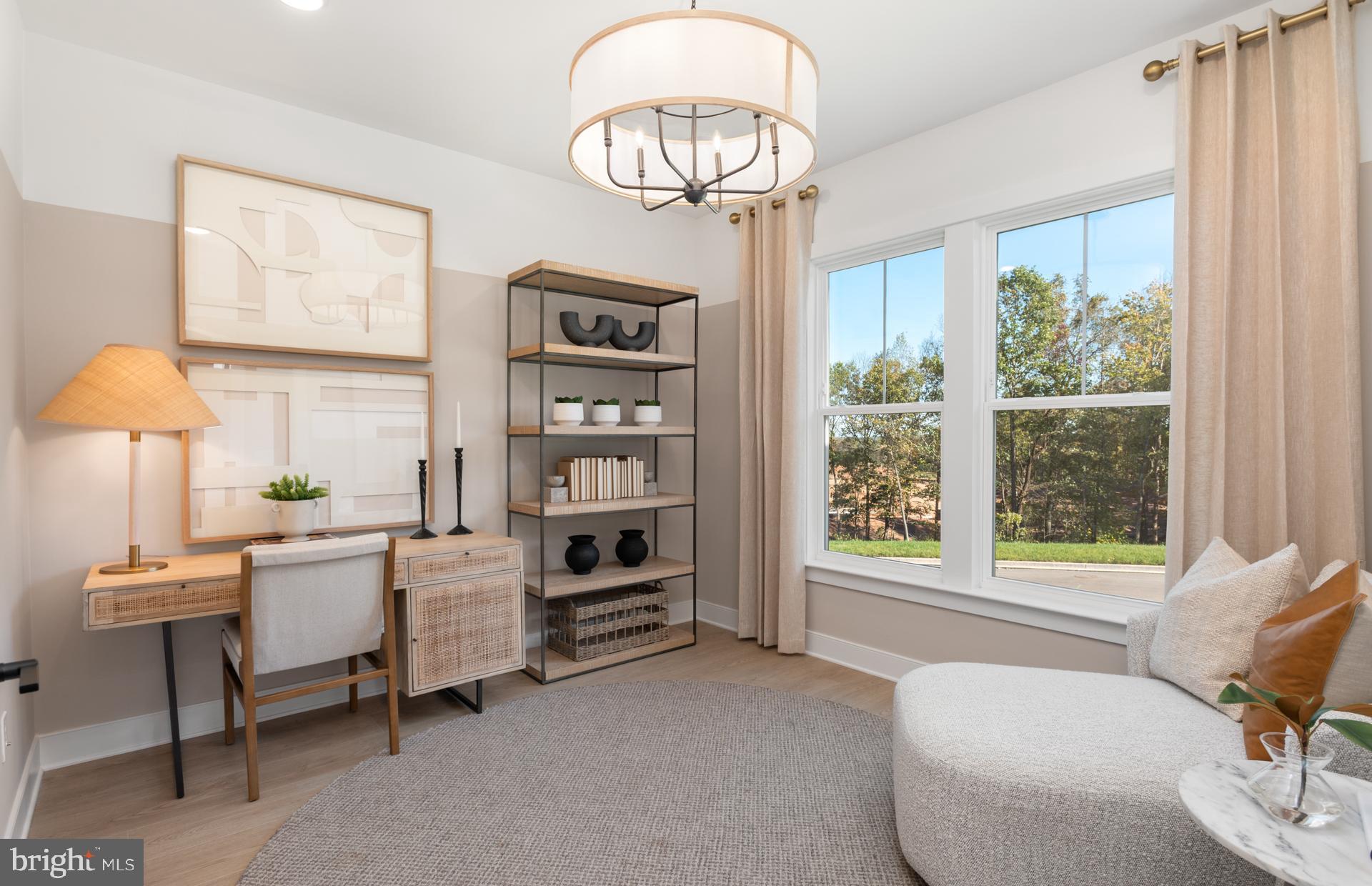 18279 Cresswell Rst Lane Leesburg, VA 20176 - Photo 23 of 60 a living room with furniture a window and a chandelier
