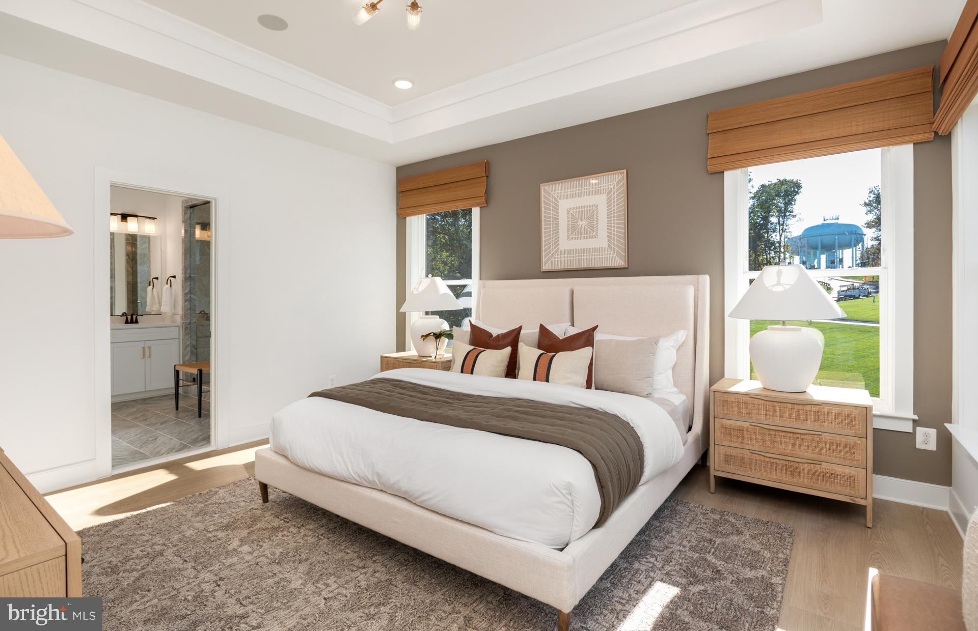 18279 Cresswell Rst Lane Leesburg, VA 20176 - Photo 28 of 60 a spacious bedroom with a bed and a couch