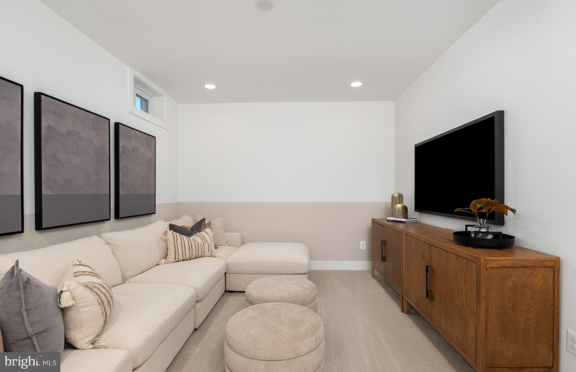 18279 Cresswell Rst Lane Leesburg, VA 20176 - Photo 39 of 60 a living room with furniture and a flat screen tv