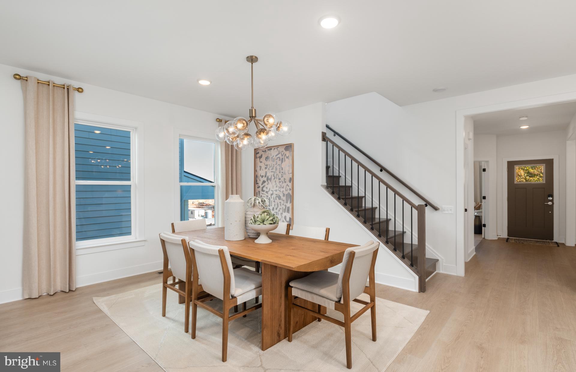 18279 Cresswell Rst Lane Leesburg, VA 20176 - Photo 9 of 60 a view of a dining room with furniture and chandelier