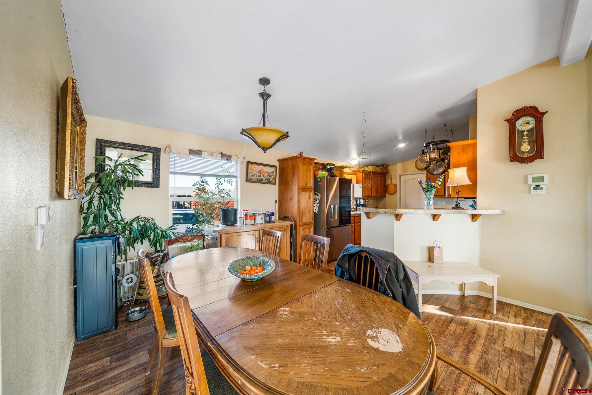 75 Sundial Lane Ignacio, CO 81137 - Photo 12 of 31 a view of a dining room filled with furniture and a chandelier