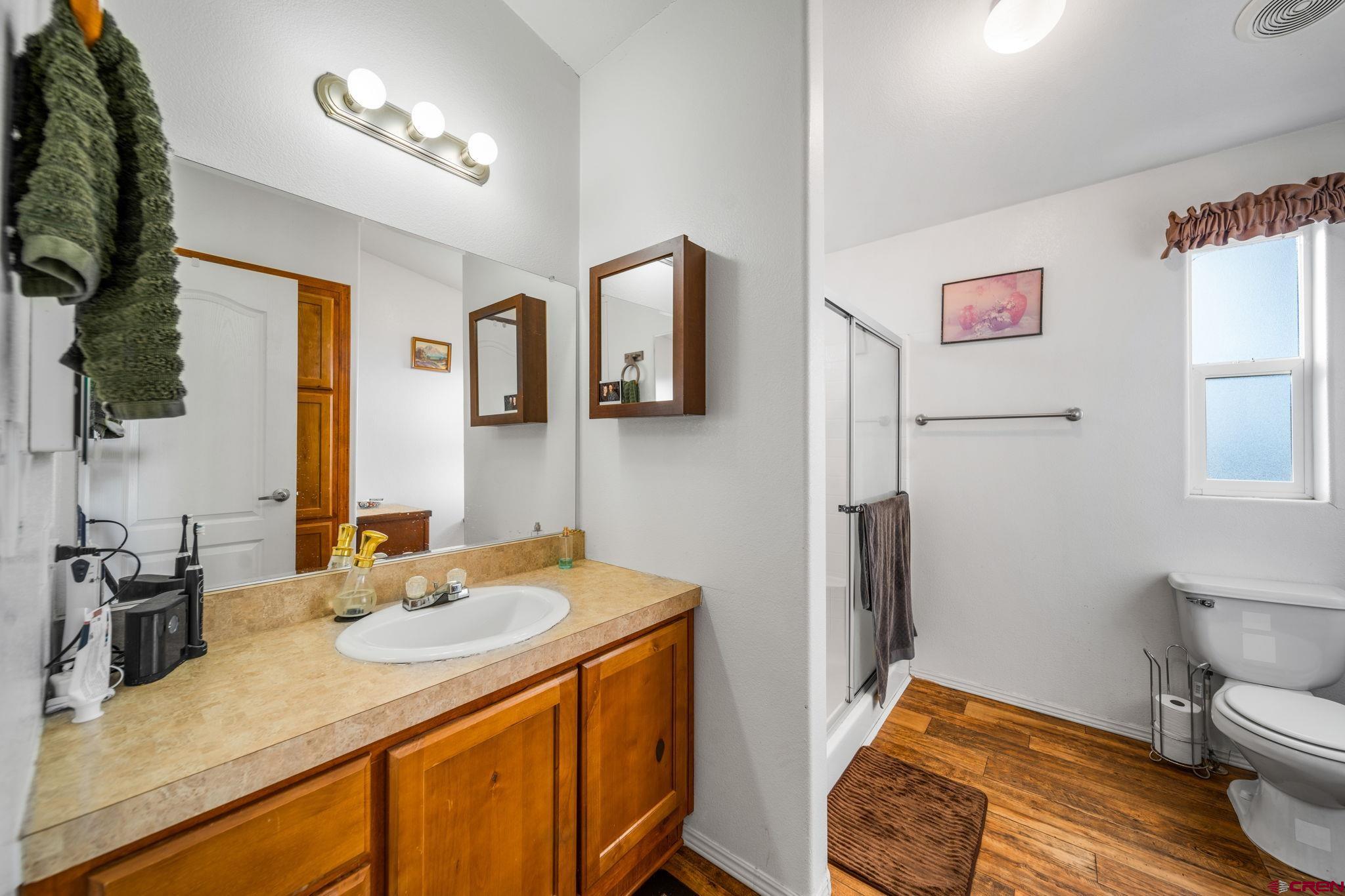 75 Sundial Lane Ignacio, CO 81137 - Photo 15 of 31 a bedroom with a sink and a mirror