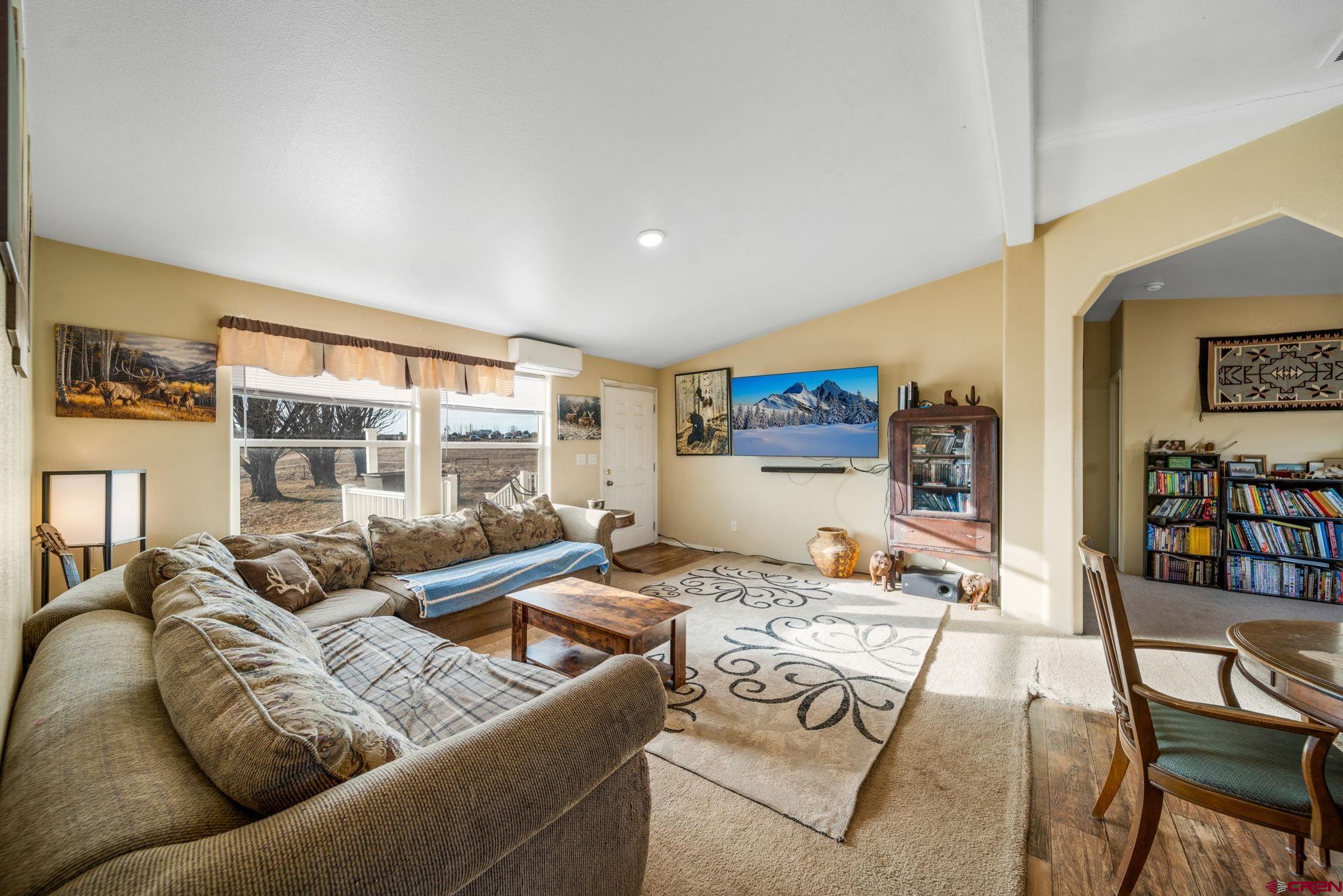 75 Sundial Lane Ignacio, CO 81137 - Photo 8 of 31 a living room with furniture and a flat screen tv