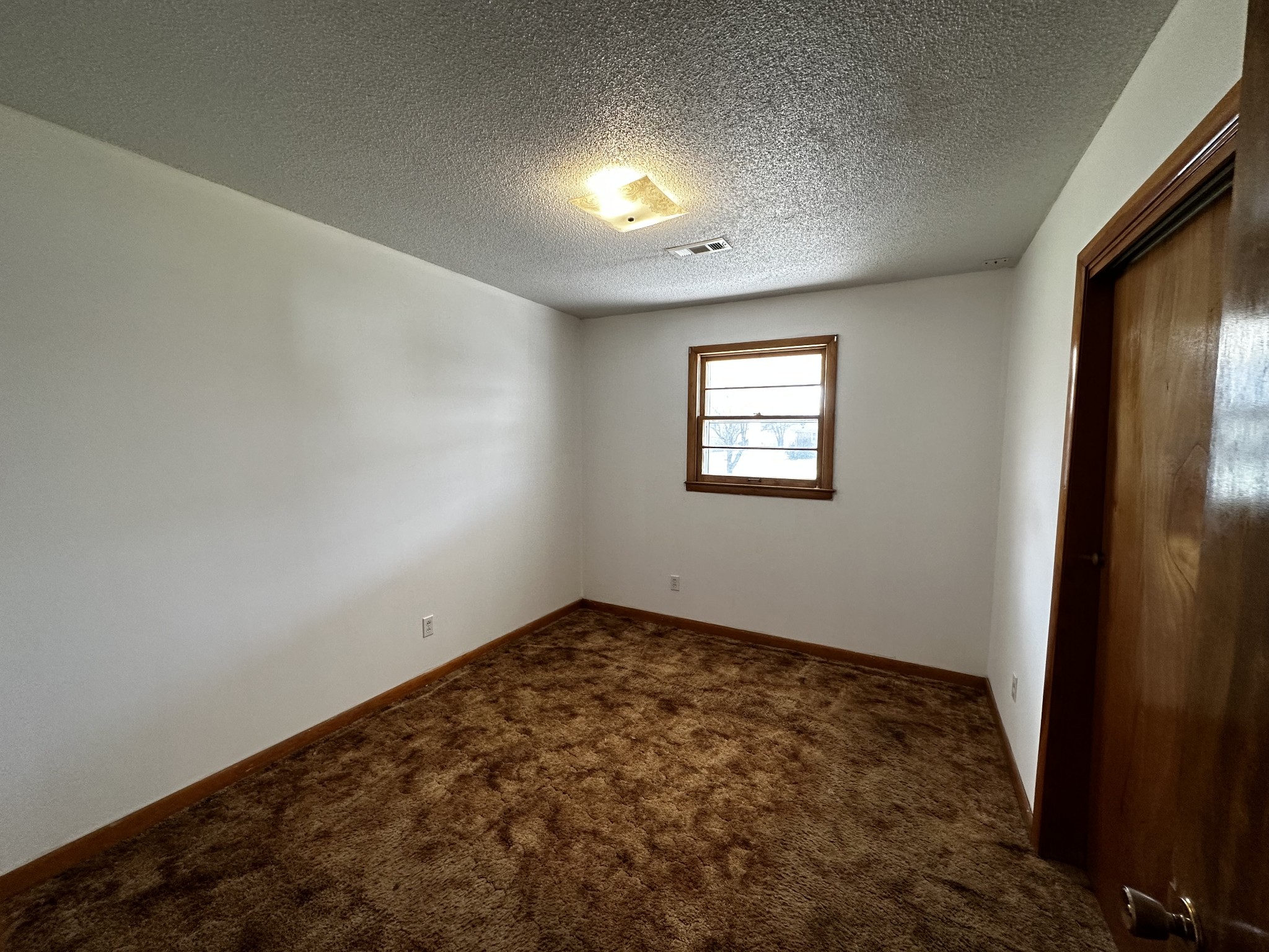 71 Hillcrest Villa Road Manchester, TN 37355 - Photo 17 of 47 an empty room with windows