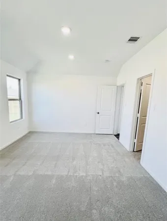 an empty room with windows