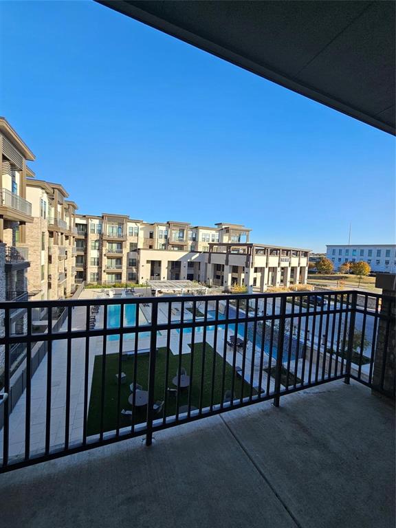 2700 Old Denton Road, Unit 3325 Carrollton, TX 75007 - Photo 5 of 6 Private balcony with concrete flooring and black metal railing