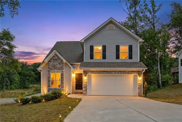 front view of a house with a yard