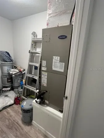 a bathroom with a sink and a wooden floor