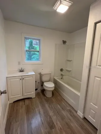 a bathroom with a sink a toilet and a bathtub