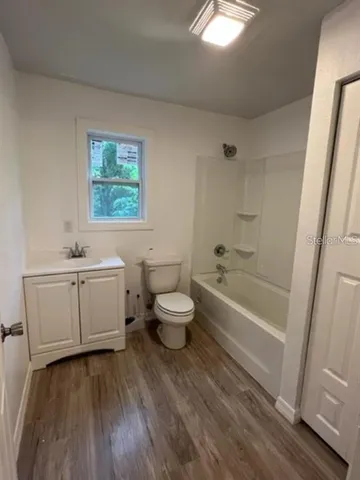 a bathroom with a sink a toilet and a bathtub