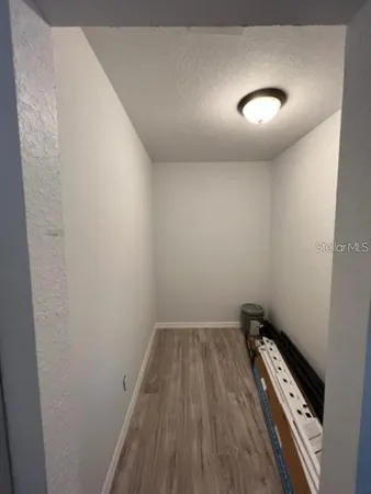 an empty room with wooden floor