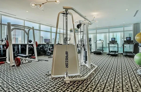 a view of room with window and wooden floor