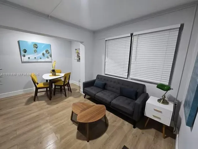 a living room with furniture and a window