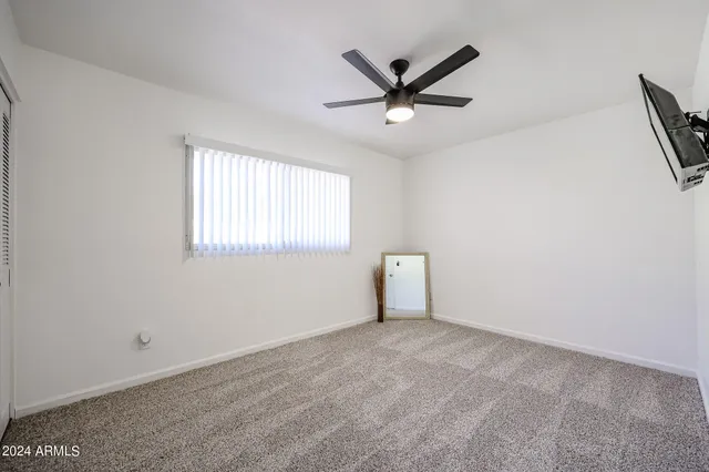 a view of a big room with carpet