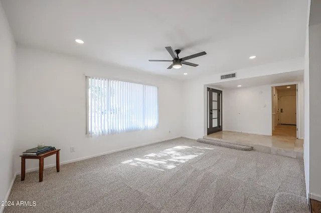 a view of an empty room with a window