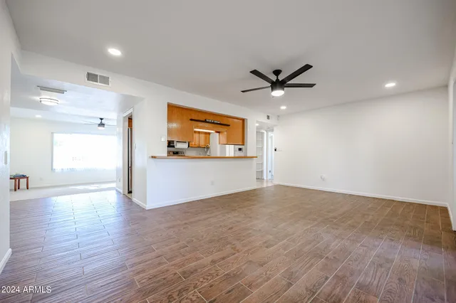 a view of a kitchen with a sink and a window