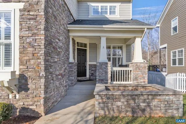 a view of a house with wooden deck