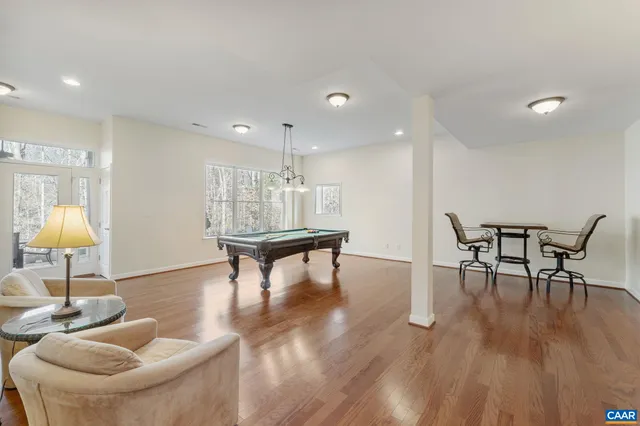 a room with furniture and wooden floor