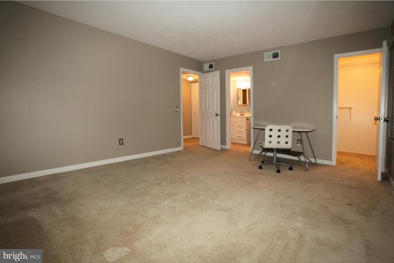 114 Fort Evans Road Southeast, Unit F Leesburg, VA 20175 - Photo 8 of 11 Walk-in closet and remodeled master bath.New Paint