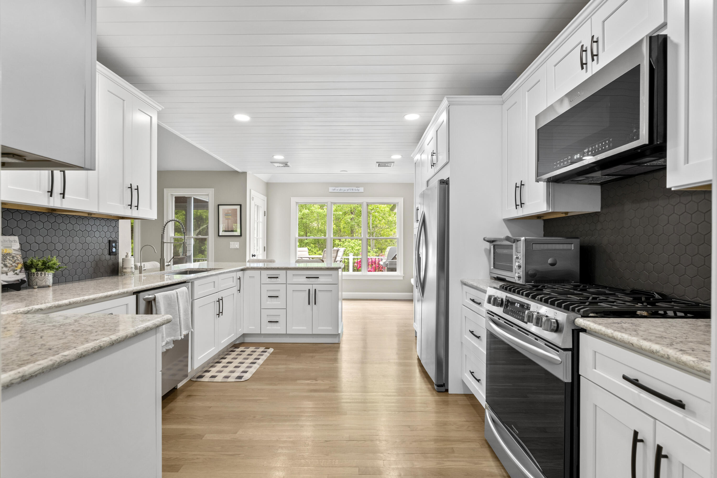 102 Cairn Ridge Road East Falmouth, MA 02536 - Photo 12 of 56 a kitchen with stainless steel appliances granite countertop a stove a sink and a microwave
