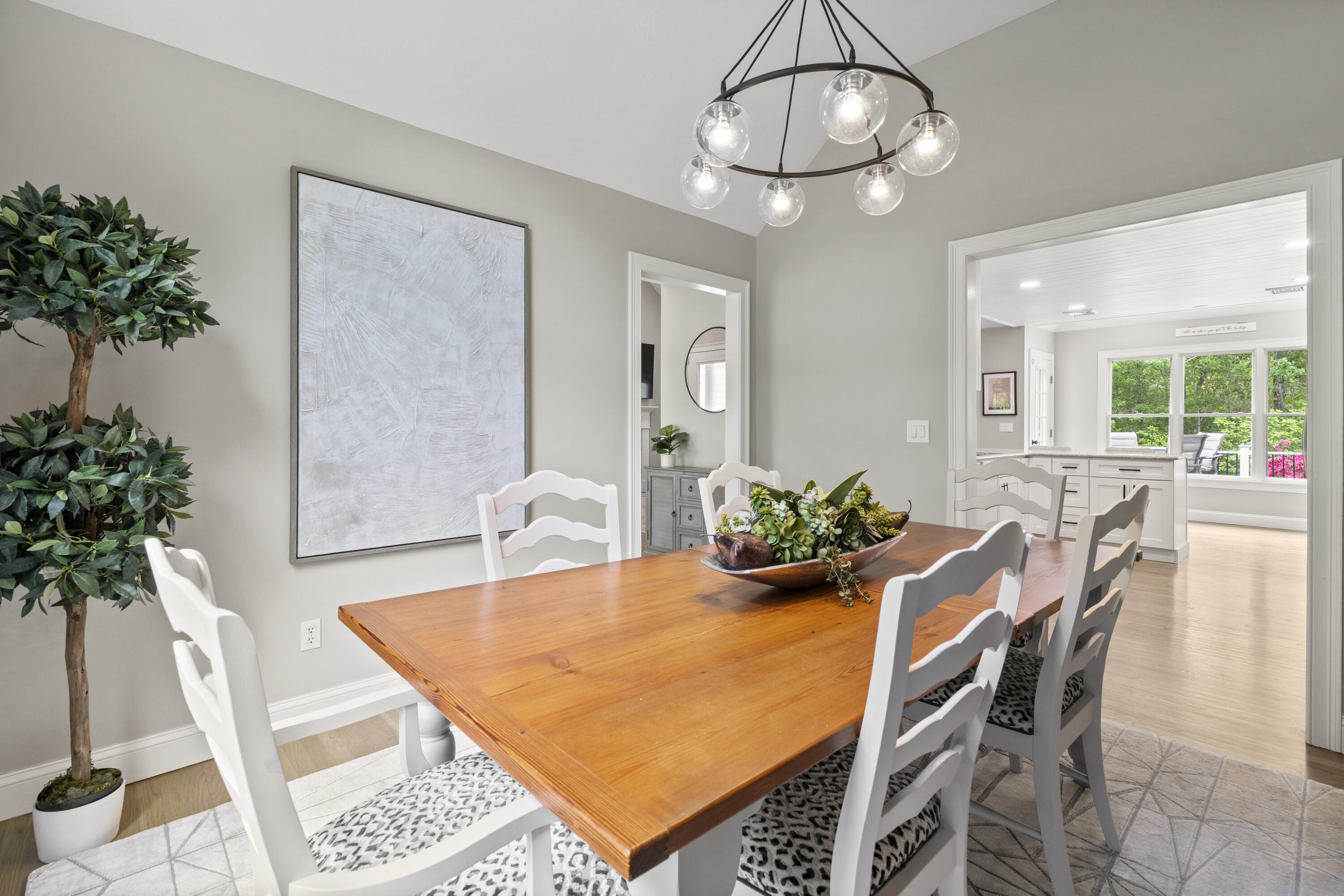 102 Cairn Ridge Road East Falmouth, MA 02536 - Photo 16 of 56 a view of a dining room with furniture and a potted plant