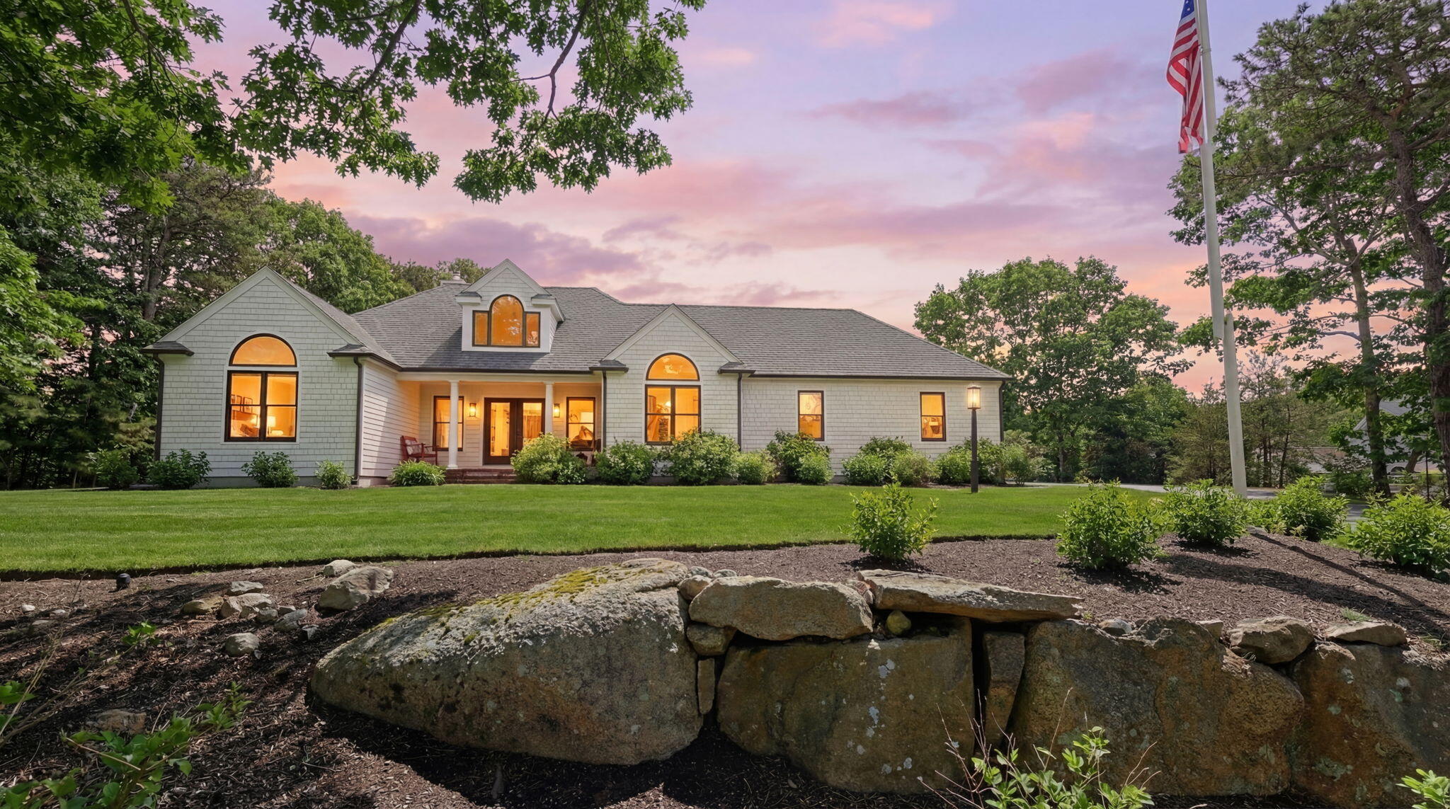 102 Cairn Ridge Road East Falmouth, MA 02536 - Photo 2 of 56 a front view of a house with a yard and garage