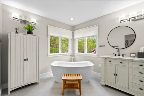 a bathroom with a mirror a sink and a mirror