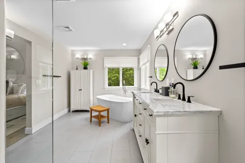 a kitchen with stainless steel appliances granite countertop a stove a refrigerator and a sink with cabinets