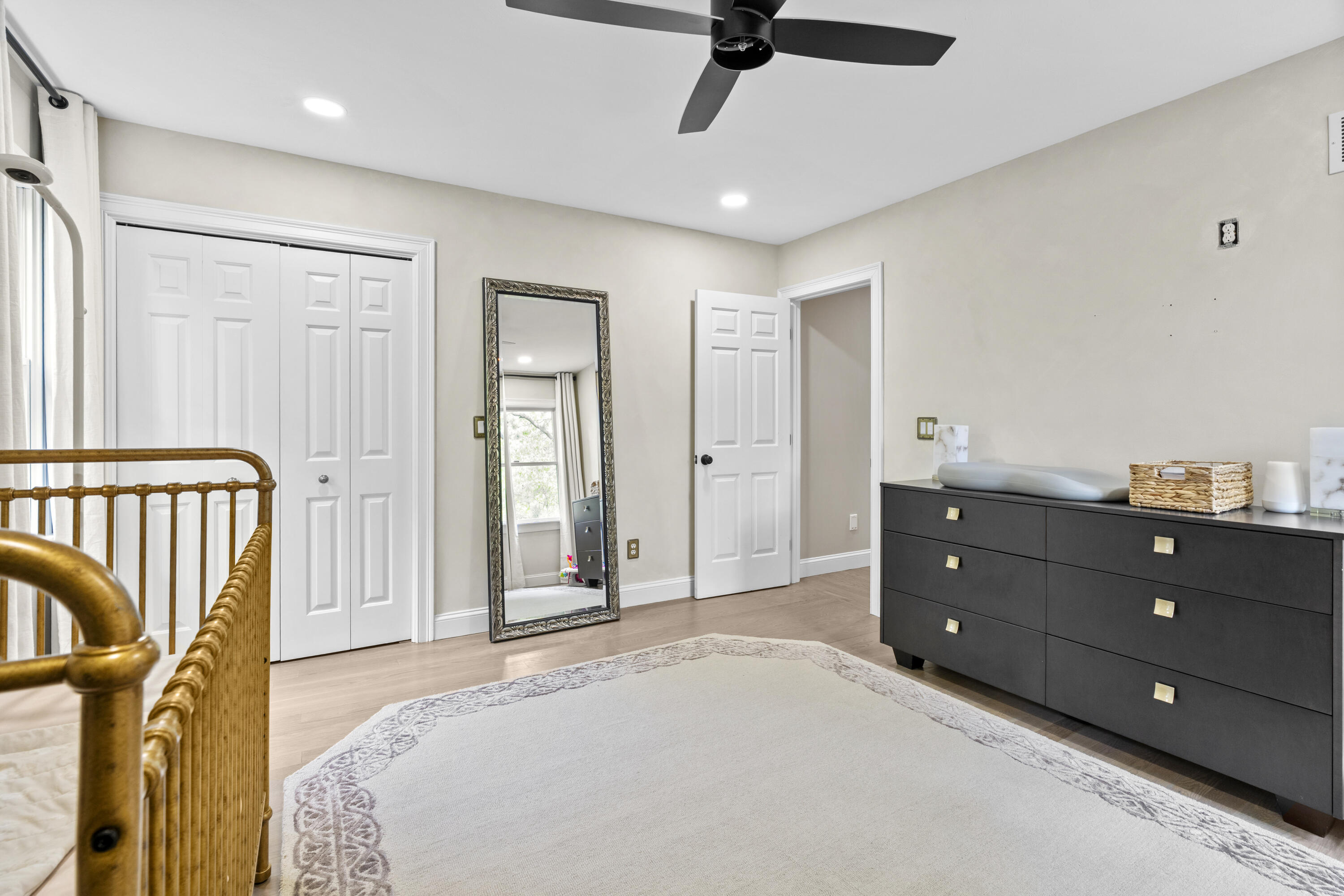 102 Cairn Ridge Road East Falmouth, MA 02536 - Photo 31 of 56 a bedroom with a bed and a dresser with the mirror