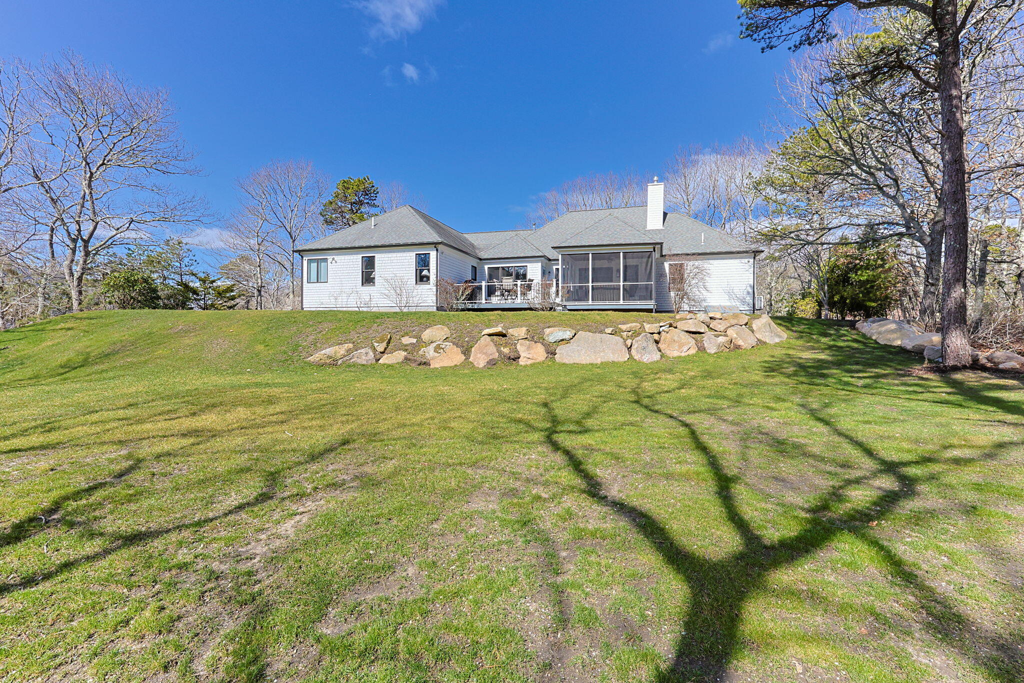 102 Cairn Ridge Road East Falmouth, MA 02536 - Photo 45 of 56 a view of a house with a big yard