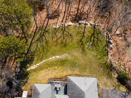 an aerial view of residential houses with outdoor space