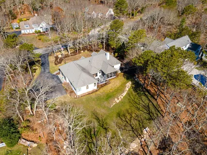 a aerial view of a house with a yard