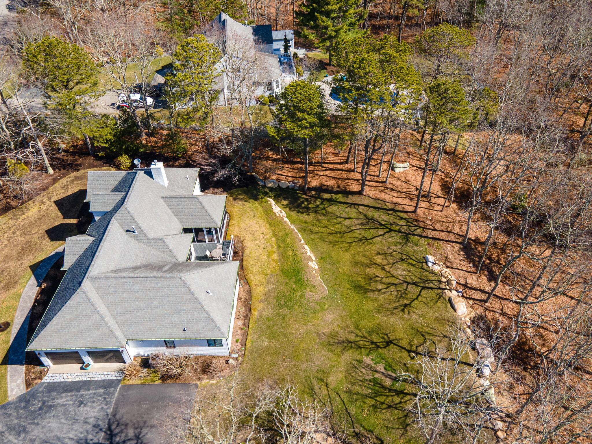 102 Cairn Ridge Road East Falmouth, MA 02536 - Photo 51 of 56 an aerial view of residential houses with outdoor space