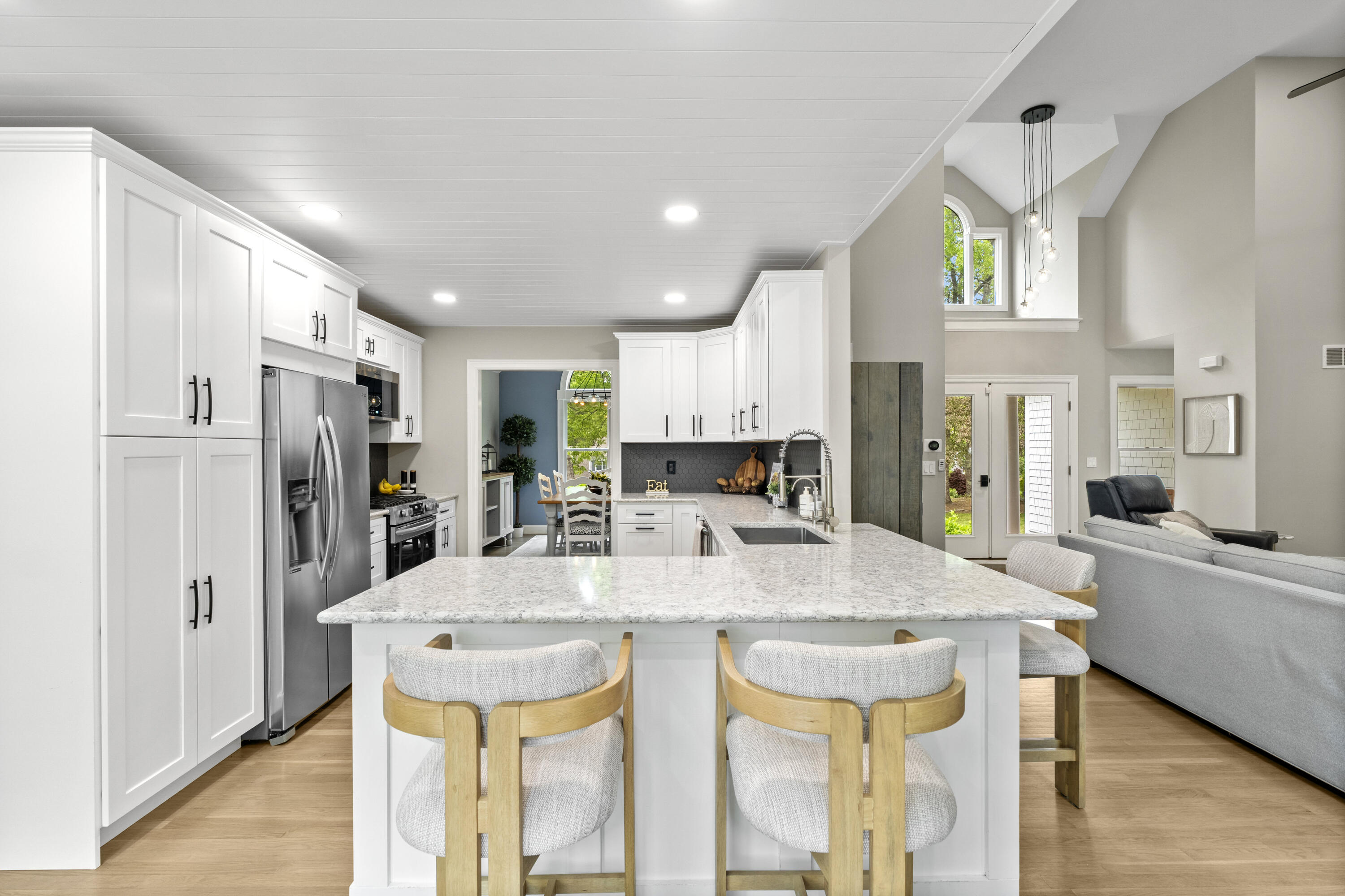102 Cairn Ridge Road East Falmouth, MA 02536 - Photo 10 of 56 a large kitchen with a table and chairs