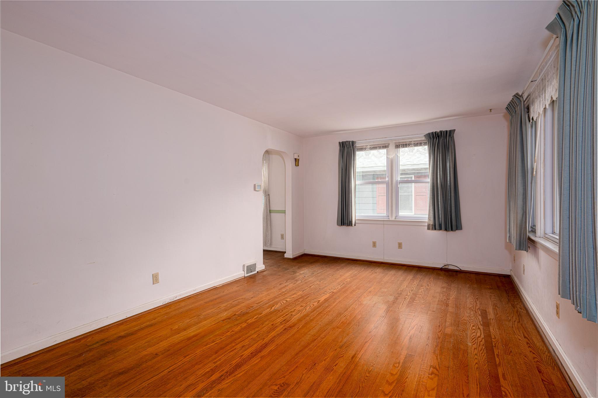 2 Norva Avenue Frederick, MD 21701 - Photo 7 of 36 an empty room with wooden floor and windows