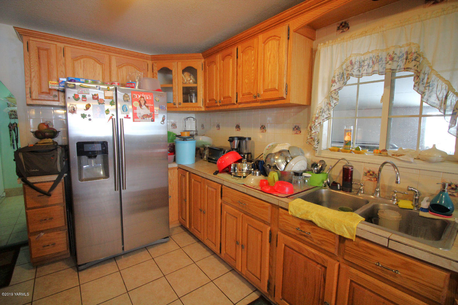 1615 Beaudry Road Yakima, WA 98901 - Photo 2 of 23 a kitchen with stainless steel appliances granite countertop a sink and a refrigerator