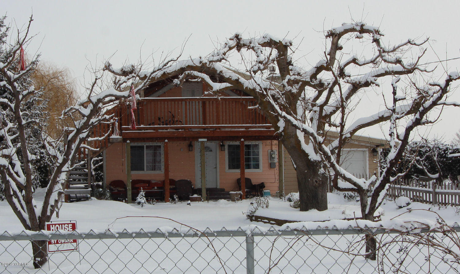 1615 Beaudry Road Yakima, WA 98901 - Photo 14 of 23 a front view of a house with a yard covered with snow