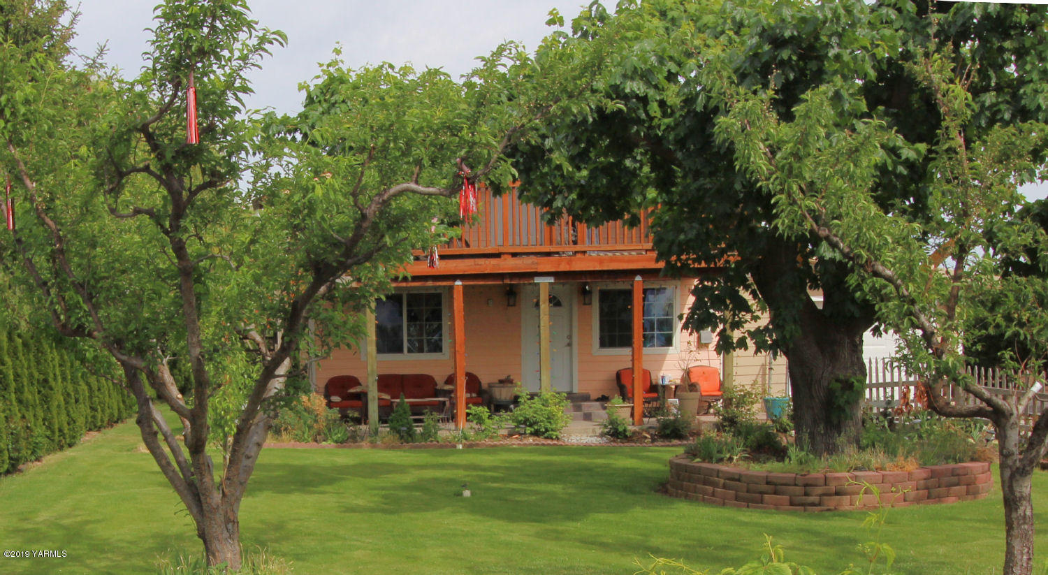 1615 Beaudry Road Yakima, WA 98901 - Photo 16 of 23 a front view of a house with a garden