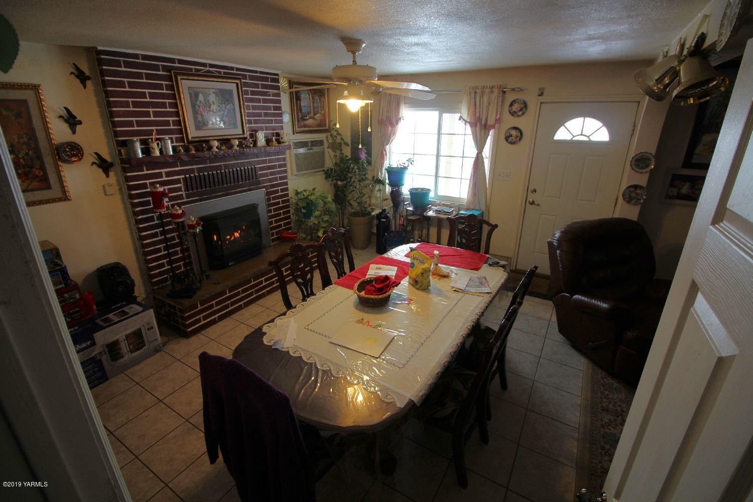 1615 Beaudry Road Yakima, WA 98901 - Photo 18 of 23 a view of a dining room with furniture and a fireplace