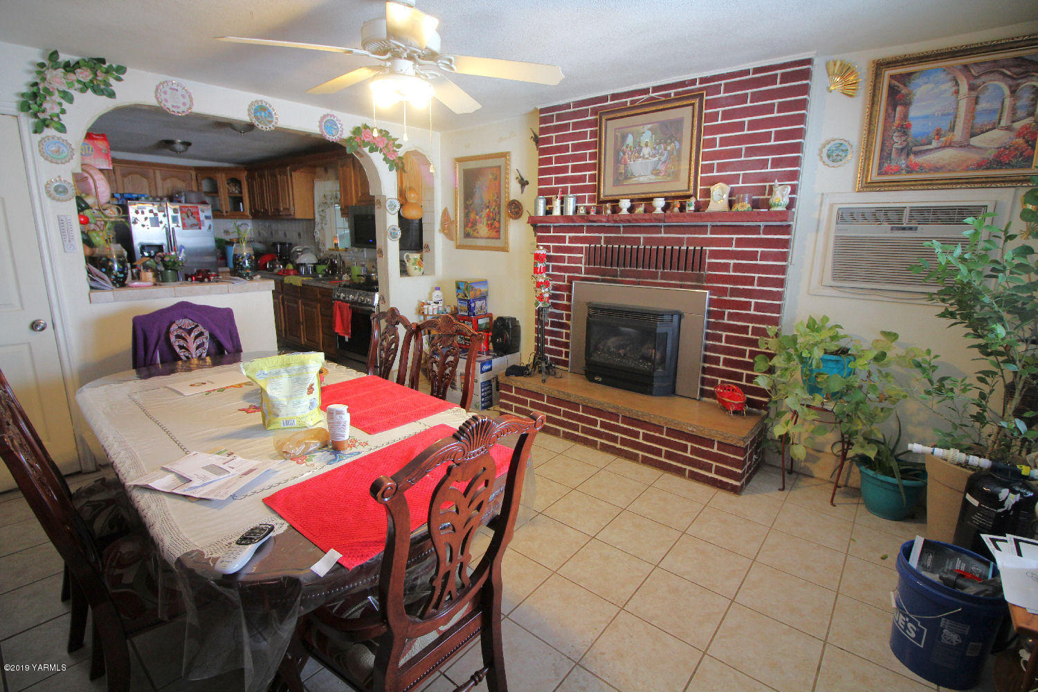 1615 Beaudry Road Yakima, WA 98901 - Photo 4 of 23 a dining room with furniture and a fireplace