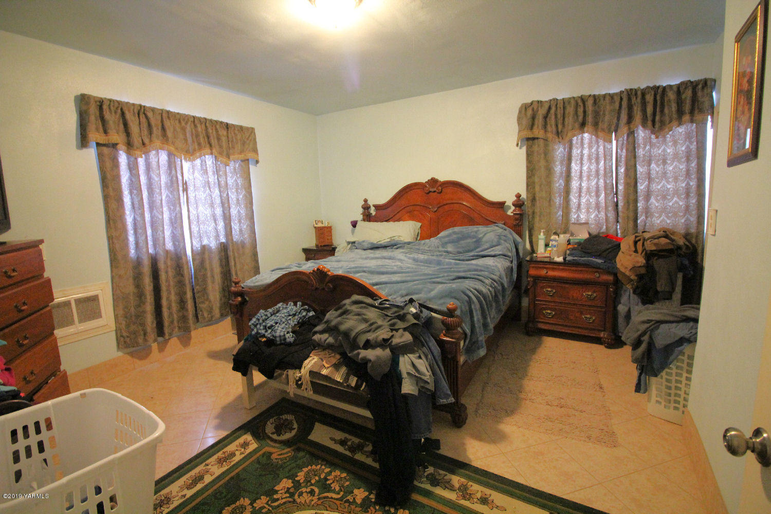 1615 Beaudry Road Yakima, WA 98901 - Photo 9 of 23 a bedroom with a bed and a window